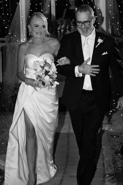 Nicole and Greg walking down the aisle right after they were wed!